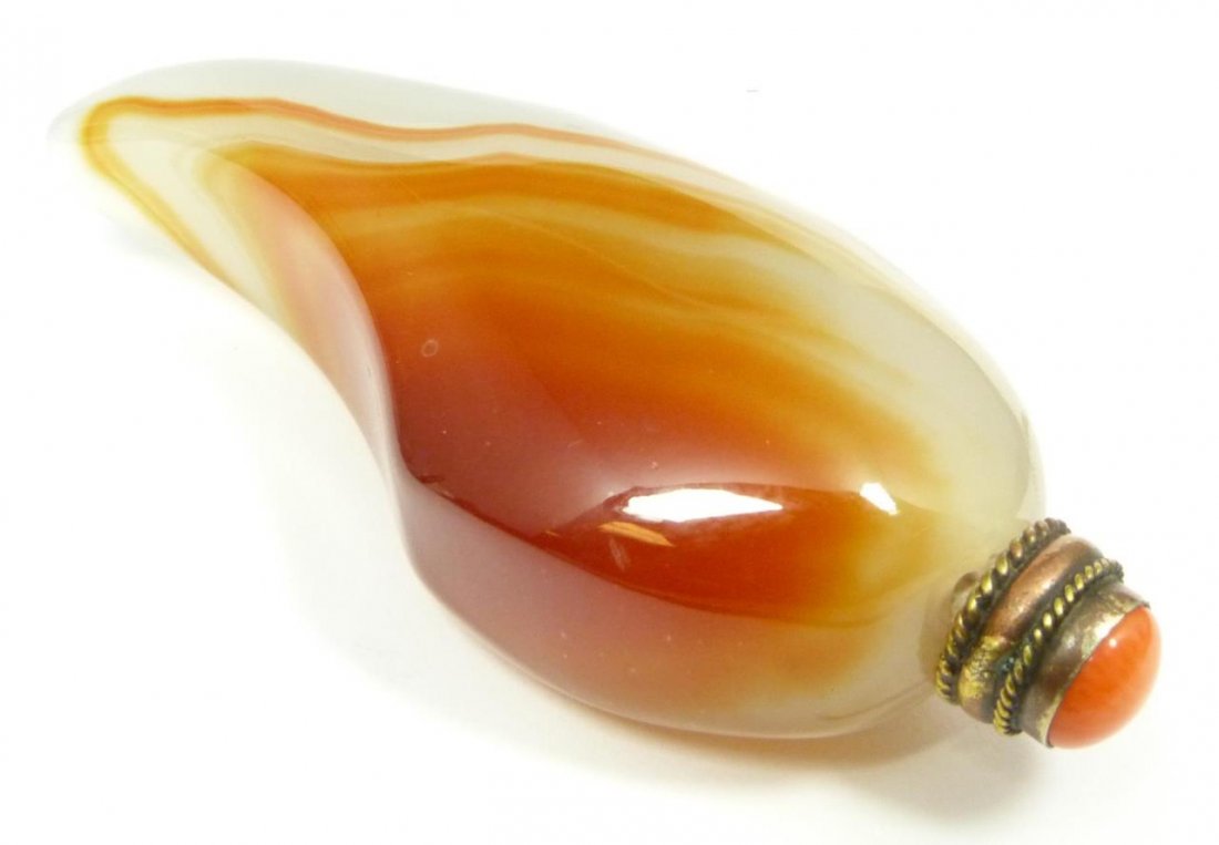 CARNELIAN HORN SHAPED SNUFF BOTTLE: Has an orange top and a horn shape. Measures 4" (10 cm) length. 99 grams.