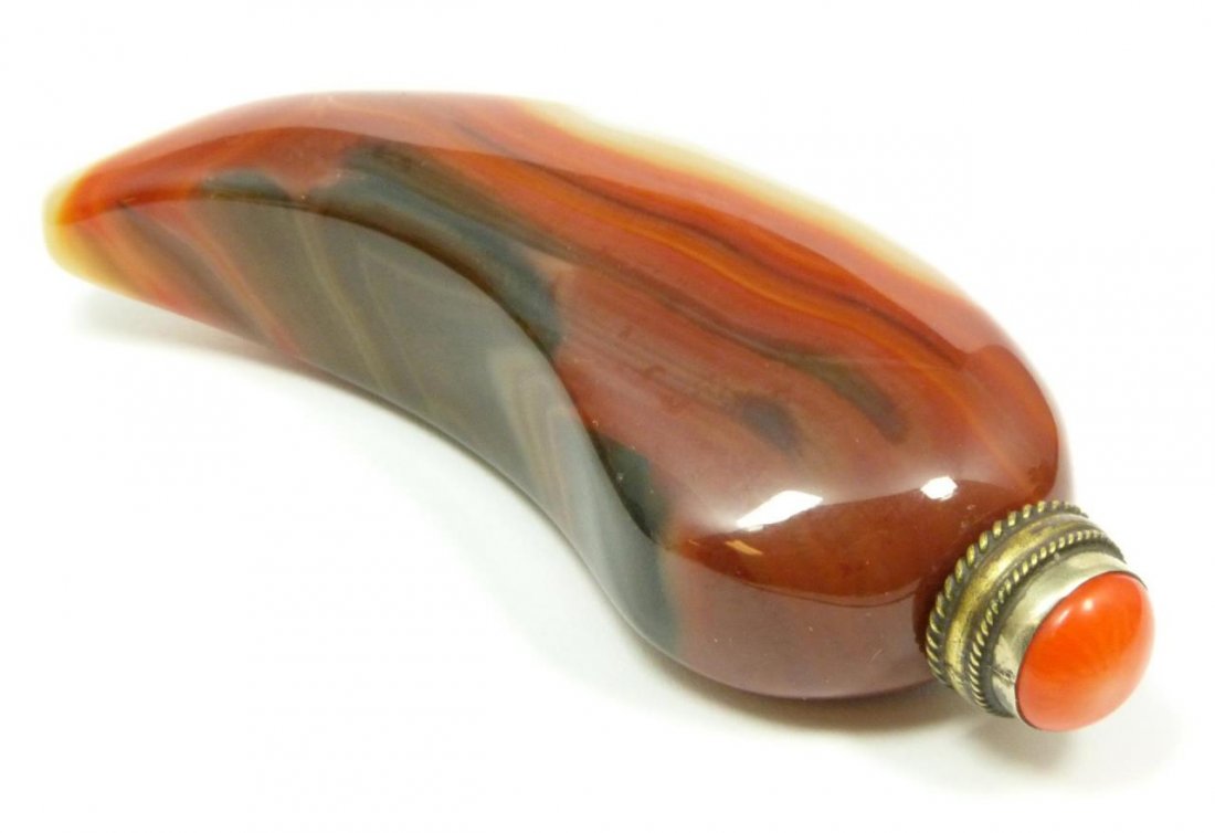 CARNELIAN HORN SHAPED SNUFF BOTTLE: Carnelian horn shaped snuff bottle. Orange top. Measures. 3 3/4" (9.5 cm) height. 108.5 grams.