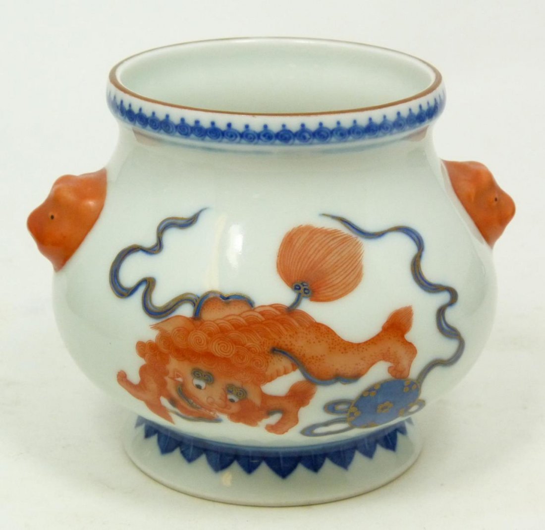 18th C CHINESE IRON RED FOO LION PORCELAIN BOWL: Antique Chinese Qing Dynasty period hand painted enameled foo lions bowl. Figural iron red foo lion handles and decoration to side with blue and gilt balls. Bottom holds blue six character zhuanshu Yo