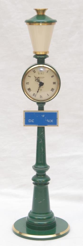 JAEGER LECOULTRE LAMP POST SWISS CLOCK: Jaeger LeCoultre Swiss figural lamp post mechanical alarm clock having green enameled finish. Measures 11" height (27.9cm).