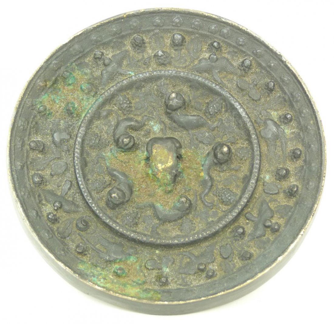 TANG STYLE QING DYNASTY PERIOD CHINESE MIRROR: Antique Chinese Tang Style mirror having raised calligraphy design. Circa Qing Dynasty period (1644–1911). Measures 5 1/2" diameter (13.9cm).