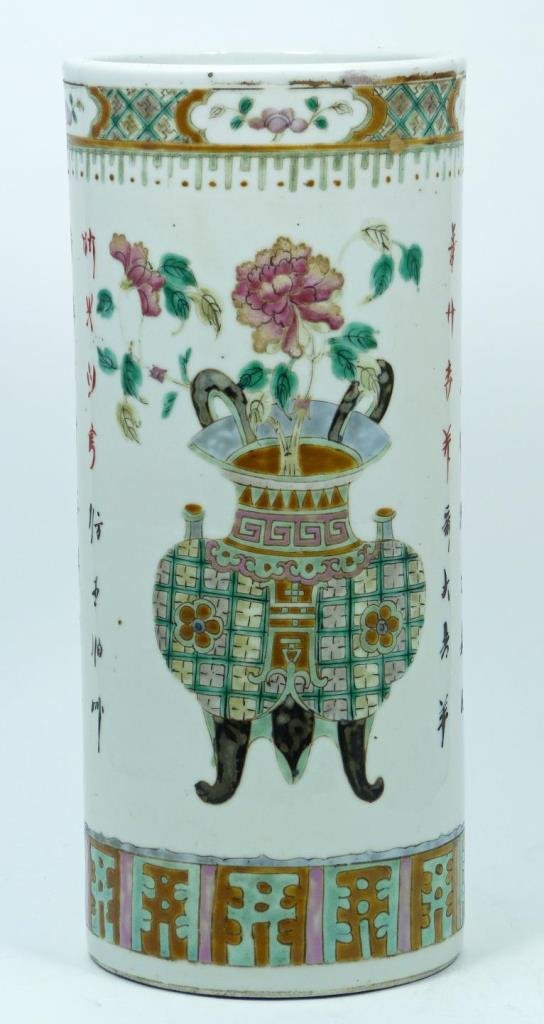 CHINESE PORCELAIN CYLINDRICAL FLORAL POEM VASE: Chinese Qianlong style porcelain cylindrical form scholar's desk brush pot. Depicts calligraphy with urns and flowers throughout. Measures 11 1/8" height x 4 7/8" diameter (28.2cm x 12.3cm).