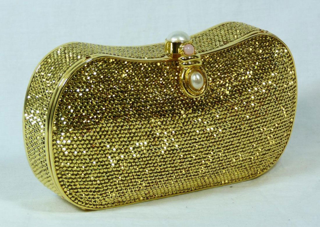 JUDITH LEIBER GILT RHINESTONE EVENING CLUTCH PURSE: Judith Leiber gilt rhinestone evening clutch purse. Judith Leiber rhinestone clutch evening purse having pearl and pink serpentine push button release and retractable chain strap, the interior fitted