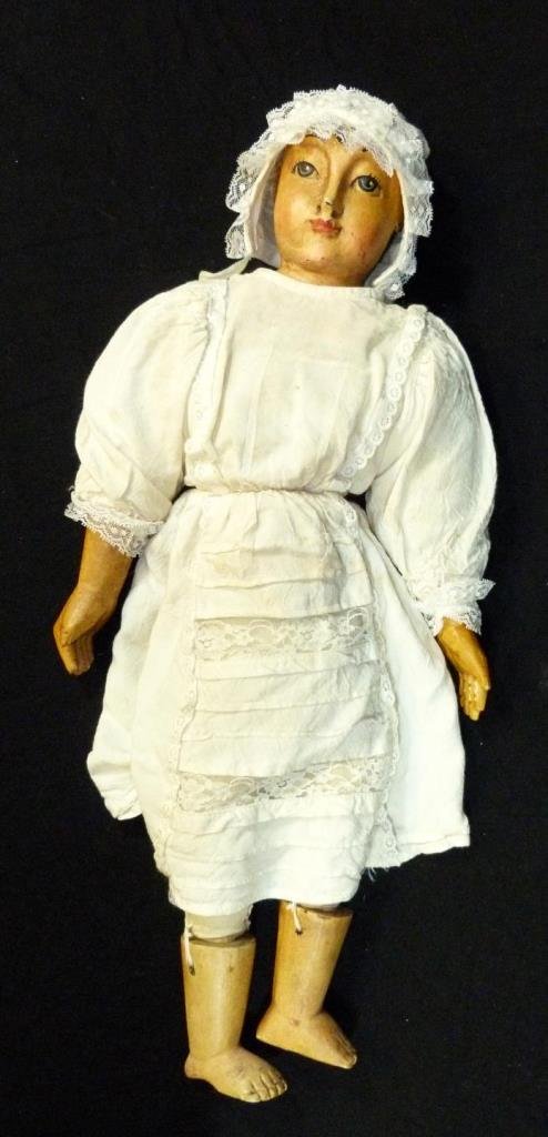 18th CENTURY STRAW STUFFED & WOODEN DOLL: Antique doll having a straw stuffed body and carved painted wood limbs. Measures 23" height (58.4cm). Total weight of 983 grams.