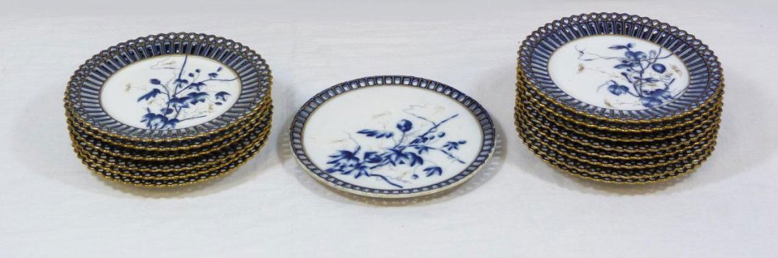 15 EUROPEAN PORCELAIN CHINOISERIE DESSERT PLATES: A set of 15 European hand painted porcelain salad / dessert plates. Each having Chonoiserie hand painted cobalt and gold accented floral design and reticulated rims. 14 plates numbered 4173. Some plat