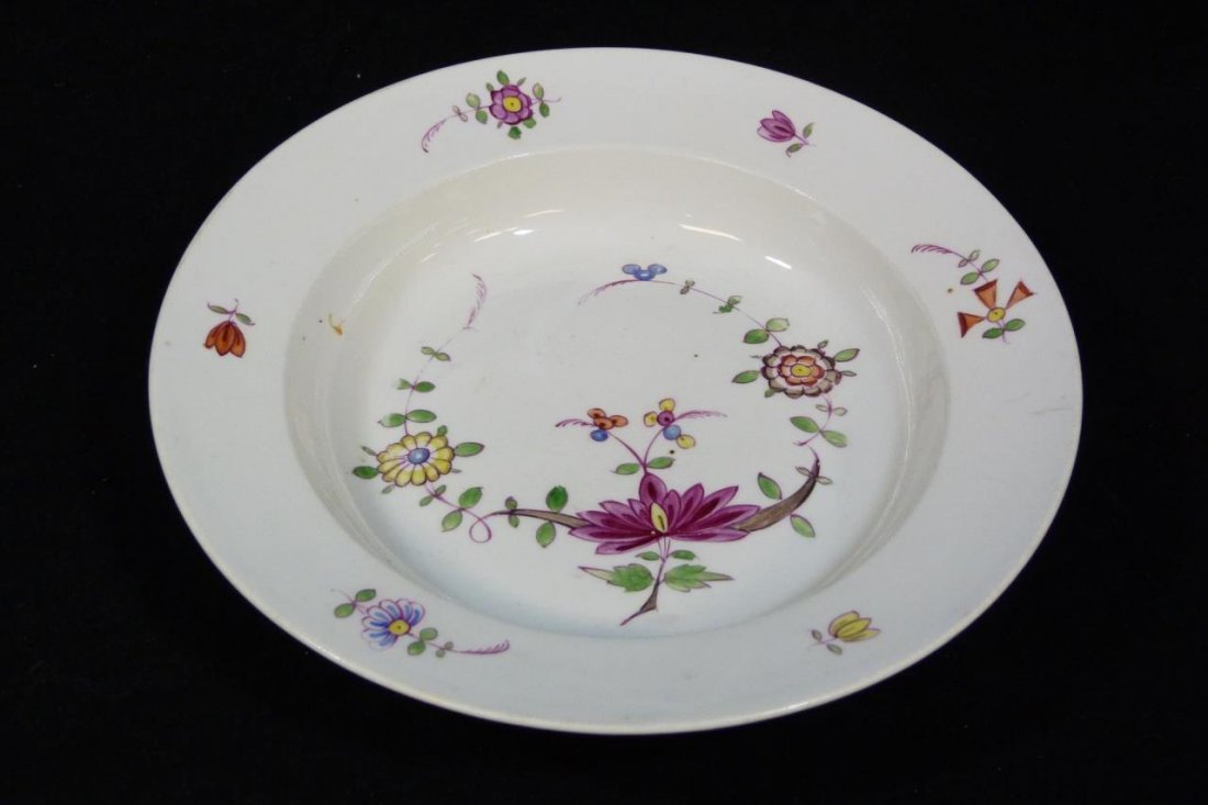 18th C MEISSEN GERMAN PORCELAIN RIM SOUP BOWL: Antique Meissen German porcelain hand painted rimmed soup bowl having a floral design. Bottom holds blue crossed swords mark with asterisk below, circa 1790-1800. Measures 1 5/8" height x 9" diameter