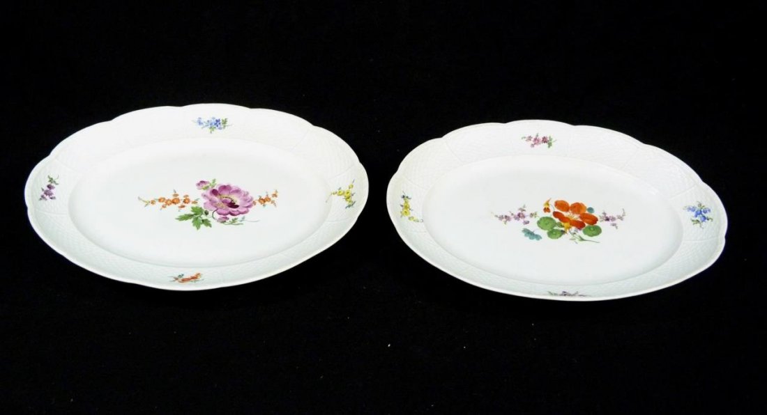 PAIR OF MEISSEN FLORAL OVAL SERVING PLATTERS 16": A pair of Meissen German porcelain oval serving platters. Each having the embossed Basket Weave design to rim. Each holds blue underglaze crossed swords mark, 19th/20th century. Measures 16" length (4