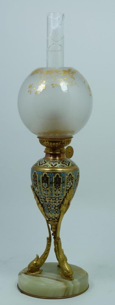 WILD & WESSEL KOSMOS CHAMPLEVE OIL LAMP: Antique Wild & Wessel Kosmos, Berlin French style Champleve enameled gilt metal lamp. Includes hurricane tube and gilded globe. 19th century. Measures 17" height (43.1cm).