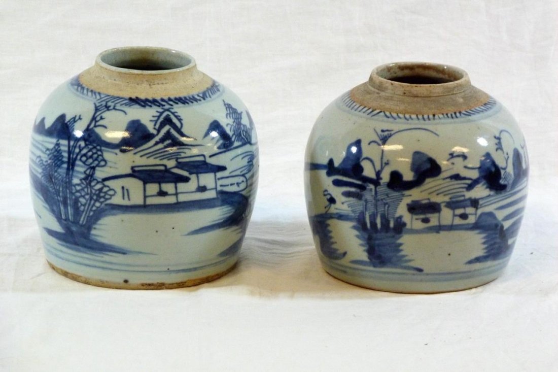 TWO CHINESE PORCELAIN BLUE & WHITE LANDSCAPE VASES: Two Chinese blue and white porcelain vases. Depicting village scenes with mountains in the back. Measures 6" (15 cm) height and 7" (18 cm) wide. Approx. 4.5 lbs.