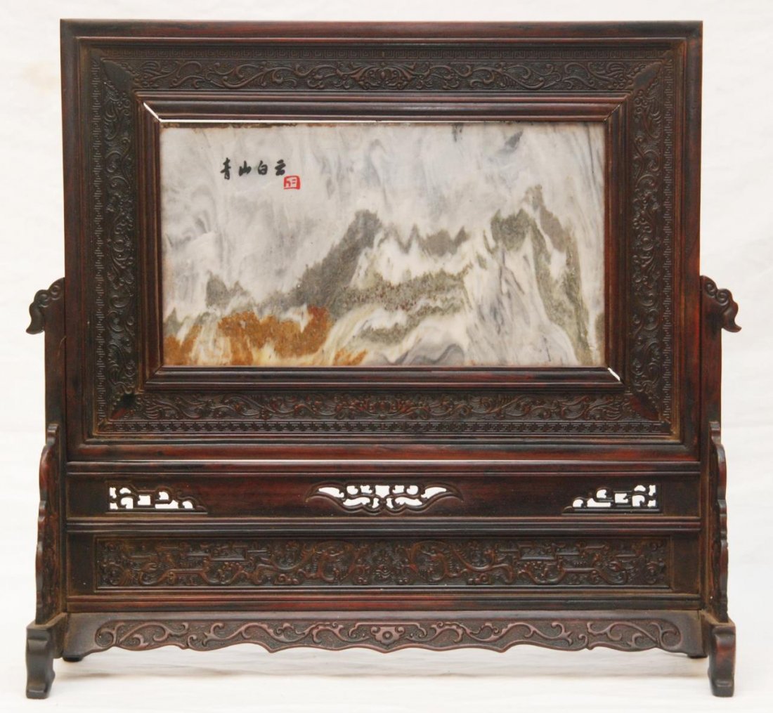18th CENTURY CHINESE STONE PLAQUE TABLE SCREEN: Antique Chinese mountain and cloud stone rectangular plaque table screen. Black calligraphy with red seal to upper left hand corner. Plaque mounted in wooden frame with finely raised crashing waves de