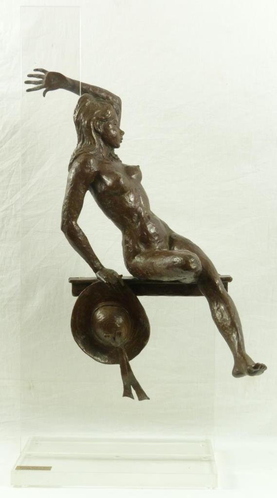 ARTHUR GLICKMAN NUDE BRONZE & LUCITE SCULPTURE: Arthur Glickman (AMERICAN, 1923) bronze and Lucite sculpture depicting a nude beauty. Titled to gold plaque on front of Lucite base 'Woman With a Hat'. Signed to hat and numbered 5/12. Measures 34 1/8