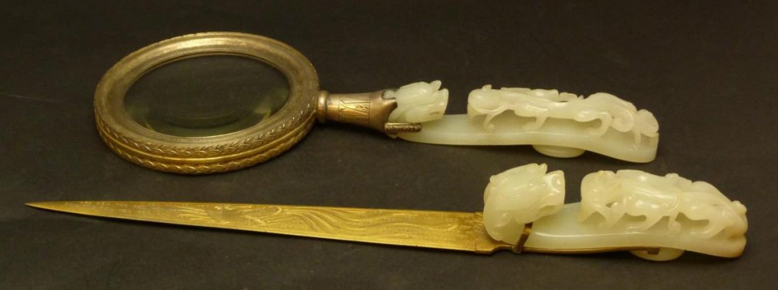 2pc BENSABBOT STERLING & JADE HOOK LETTER SET: A stunning Bensabbot, Chicago sterling silver desk set including a gold wash magnifying glass and letter opener. Each item mounted with figural hand carved jade garment hook. Finely carved depicting C