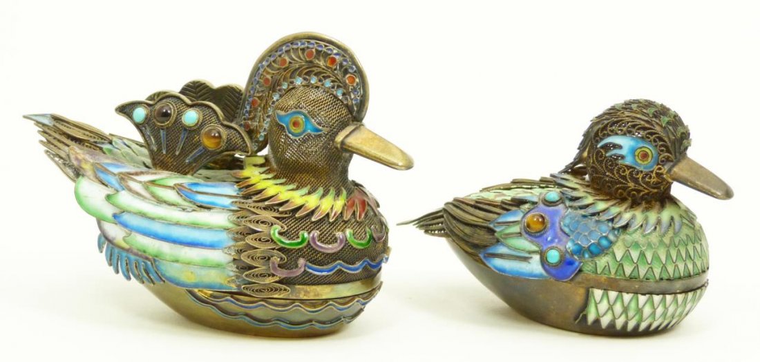 Pr CHINESE ENAMELED SILVER VERMEIL BIRD BOXES: Pair of Chinese hand painted and enameled filigree silver vermeil figural bird boxes. Qing Dynasty to Republic Period, 19th/20th century. Largest measures 3 1/4" height x 4 3/4" length (8.2cm x 12cm).