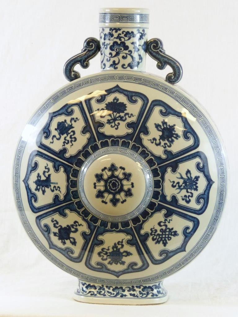 CHINESE QING BLUE & WHITE PORCELAIN FLASK VASE: Antique Chinese Qing Dynasty hand painted blue and white porcelain flask vase depicting a floral design throughout with protruding nipple to front and back. Figural lingzhi root handles. Holds Qianlon