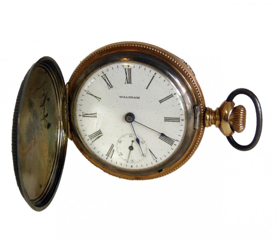 ANTIQUE STERLING WALTHAM HUNTER POCKET WATCH: Antique American Waltham Watch Company pocket watch having a rose gold plated two tone sterling silver hunter case numbered 273792. One side depicting a standing stag and the other depicts flowers wit
