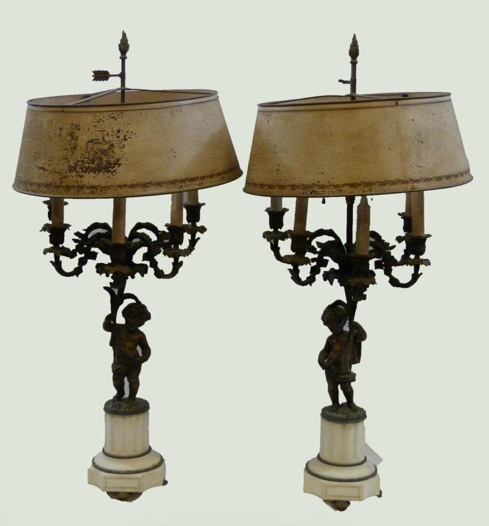 Pr EARLY 20th C FIGURAL CHERUB CANDELABRUM LAMPS: A pair of old figural gilded bronze cherub candelabrum lamps. Each depicting standing nude cherub propping up six candle arms with center arm being lamp shaft, base constructed of solid white tone mar