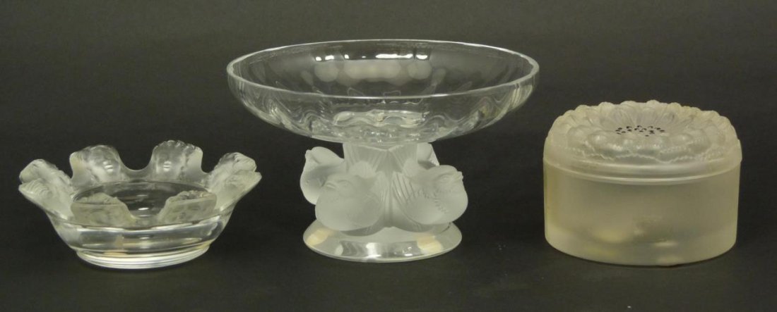 3 LALIQUE FRANCE CRYSTAL: TRAY, COMPOTE & BOX: A lot of three Lalique French crystal items including a Saint Nicholas ashtray, Nogents birds compote and Dahlia No. 3 covered box. Largest item measures 3 1/4" height x 5 1/2" diameter (8.2cm x 13.9c