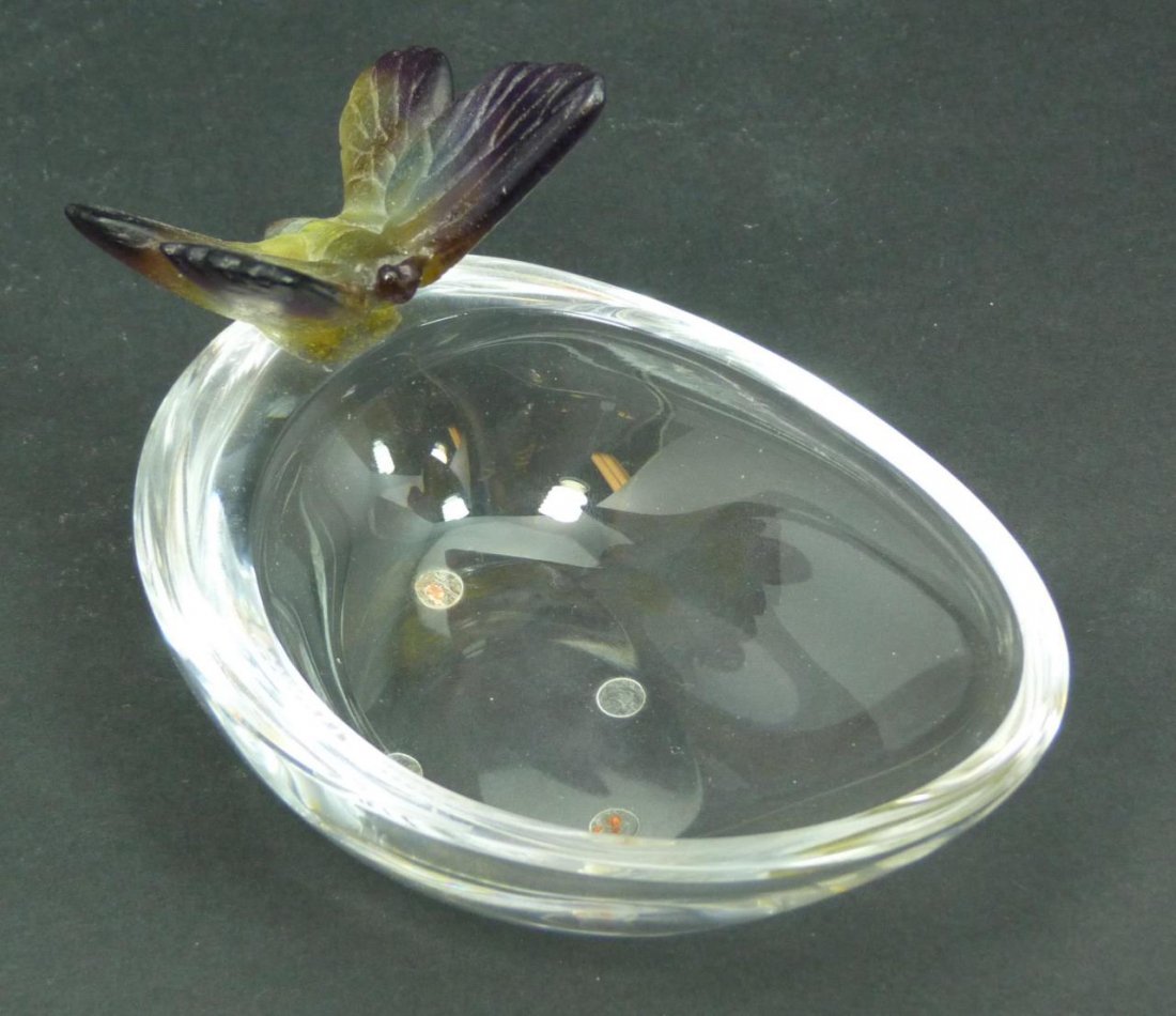 DAUM PATE DE VERRE & CRYSTAL BUTTERFLY BOWL: Daum Pate de Verre and clear crystal art glass bowl depicting a purple to yellow and clear tone butterfly to rim. Script 'Daum France' signature to top of rim. Measures 2 7/8" height x 5" length (7.3c