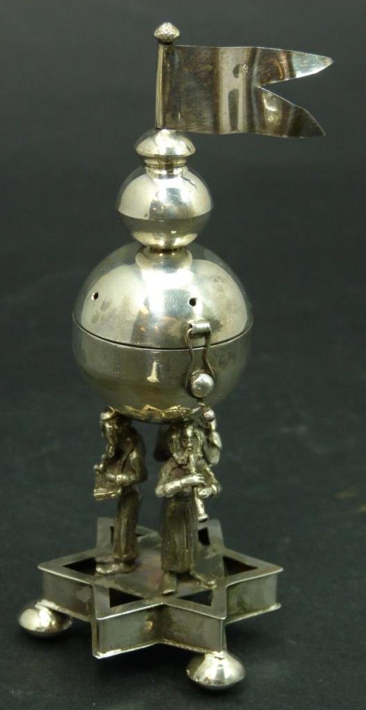 RUSSIAN JUDAIC SILVER STAR OF DAVID SCENT BOX: A Russian silver Judaic scent box having a figural Star of David design to base. Scent box is propped up by three Hasidic men playing instruments. Bottom holds impressed 84 silver purity marks with to