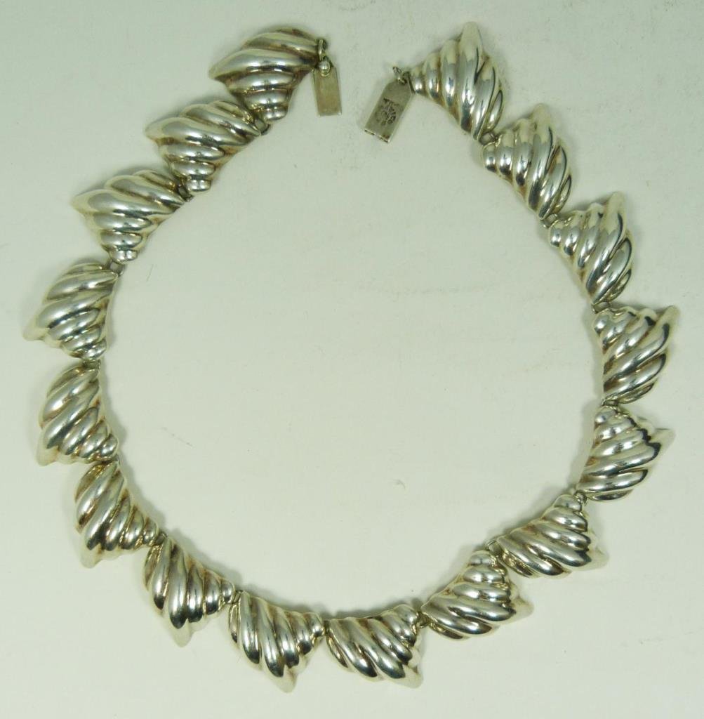 MEXICAN STERLING SILVER NECKLACE WITH SHELL DESIGN: Mexican sterling silver necklace having a seashell design. Measures 18 1/2" length (46.9cm). Measures 25mm width. Total weight of 4.2ozt.