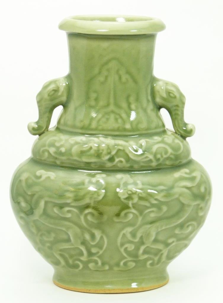 18th C CHINESE CELADON DOUBLE DRAGONS VASE: Antique Chinese celadon glaze double dragons vase. Raised designs throughout. Figural elephant head handles to neck. Bottom holds incised Qianlong reign mark, but possibly made later in the Qing Dynas