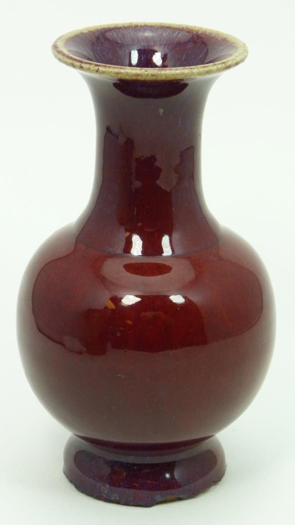 19th C CHINESE OX BLOOD GLAZED BOTTLE VASE: Antique Chinese ox blood red glazed porcelain gobular form vase. Bottom holds black calligraphy mark. Circa Qing Dynasty period, early 19th century. Measures 5 7/8" height (14.9cm). Total weight of 33