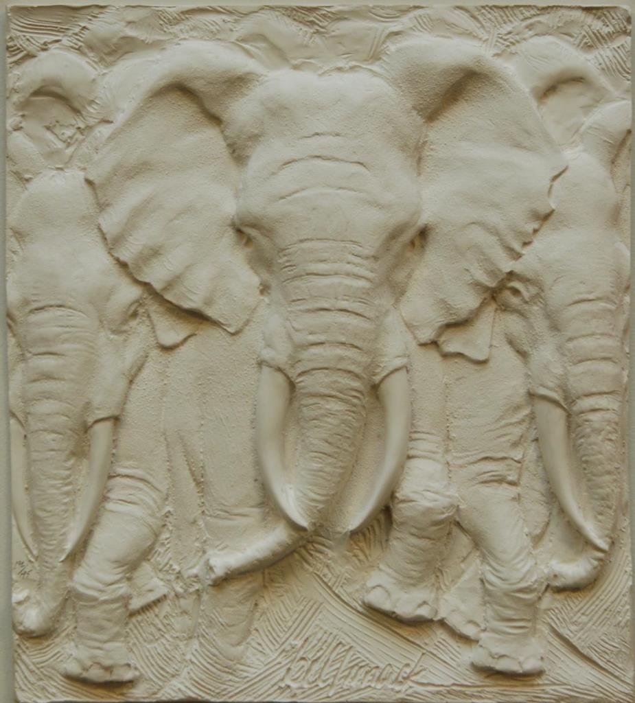 BILL MACK BONDED SAND PLAQUE 'STAMPEDE' 192/195: Bill Mack (AMERICAN, 1949 - ) bonded sand white plaque depicting elephants and titled 'Stampede. Signed to lower right and numbered 192/195 to lower left. Set to gold tone frame and matting. Includes