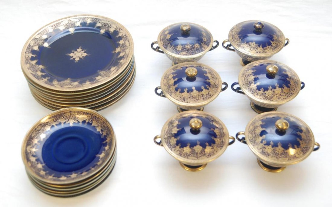 21pcs NIPPON COBALT & GOLD DECORATED DINNERWARE: Twenty one pieces of Nippon Japanese hand painted dinnerware items having ing gold decoration over cobalt ground. Set includes 9 salad / dessert plates (8 5/8"), 6 covered cream soup bowls (4 1/4") an