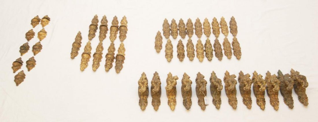 66pcs 19th FRENCH DORE BRONZE DOOR HARDWARE: A lot of sixty six French dore bronze door hardware applique items. Each having a scrolled design. Pieces approx. 6 3/4" length (17.1cm). Total weight of approx. 20.3 kilograms.