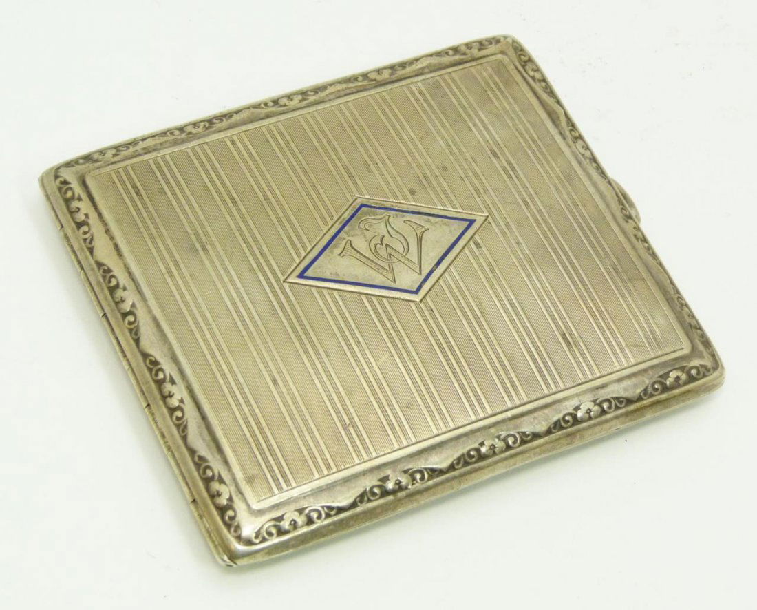 EARLY 20th CENTURY 800 SILVER CIGARETTE CASE: An old German 800 silver cigarette case having a cobalt blue enameled cartouche to exterior. Interior holding etched 'Weinachten 1928' (Christman 1928). Has JW monogram to exterior. Interior holds imp