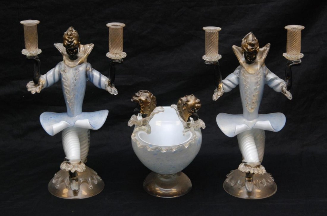 VENETIAN LATTICINO GLASS GOLD FLECK GARNITURE: Venetian Latticino glass gold fleck Blackamoor garniture set. Includes two figural candelabra with kneeling men holding up to candle arms. Also includes center piece bowl two figural heads. clear to w