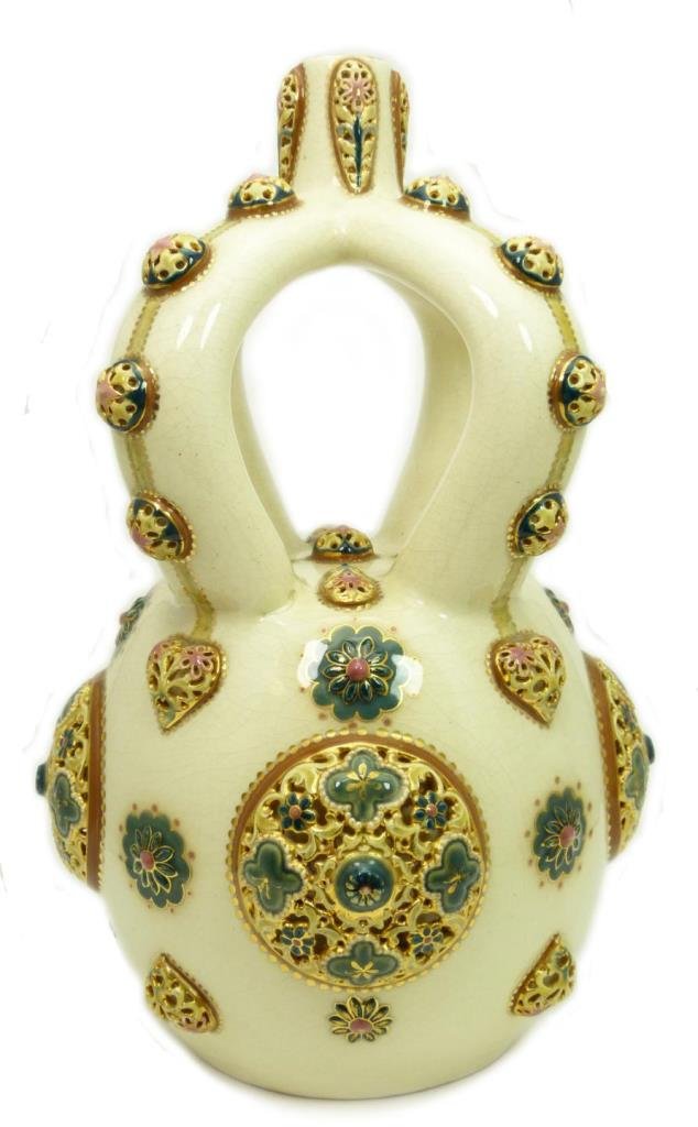 19th C ZSOLNAY HUNGARIAN POTTERY VASE, MODEL 1089: Antique Zsolnay Hungarian pottery vase. Has raised reticulated flower and heart designs with and interesting four handle design. Model number 1089. Holds blue underglaze and impressed marks to bottom.