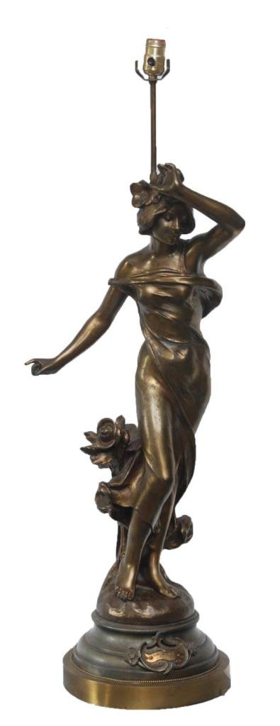 GILT FRENCH METAL FIGURAL LAMP OF WOMAN, CAUSSE: A French Art Deco gilt metal figural lamp depicting a standing woman with flowers by Julien Causse (FRENCH, 1869-1909). Applique plaque to front with title 'LA ROSE'. Also marked 'PAR J. CAUSSE'. Circ