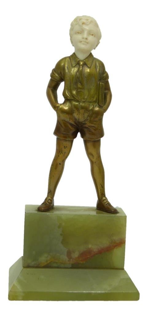 F. PRIESS GERMAN BRONZE SCULPTURE 'SCHOOLBOY': Ferdinand 'Fritz' Preiss (GERMAN, 1882 - 1943) bronze sculpture depicting a boy standing wearing a school uniform and holding a book with hands in pockets. Gilded throughout exterior. Unsigned. Mounte