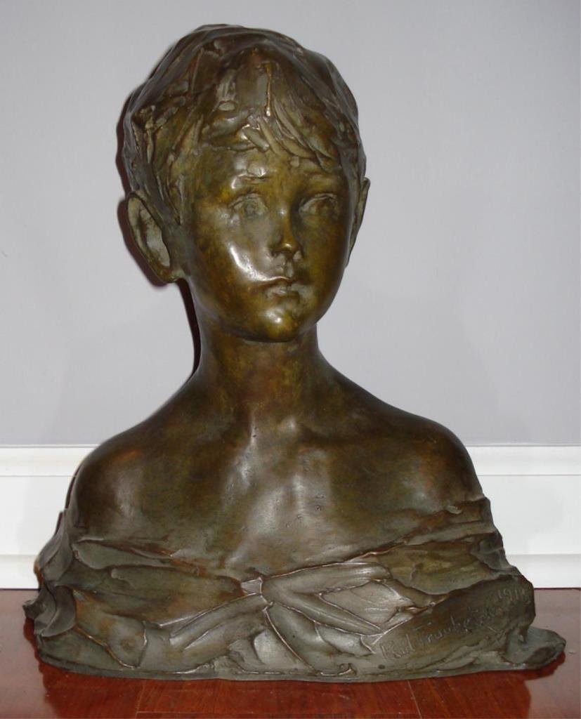 PAUL TROUBETZKOY BRONZE BUST OF A YOUNG BOY: Bronze depicting the 'Bust of a Young Boy' after Prince Paolo Troubetzkoy (RUSSIAN, 1866-1938). Signed to front lower right and dated 1915. Measures 12 1/2" height x 12" width (31.7cm x 30.5cm).