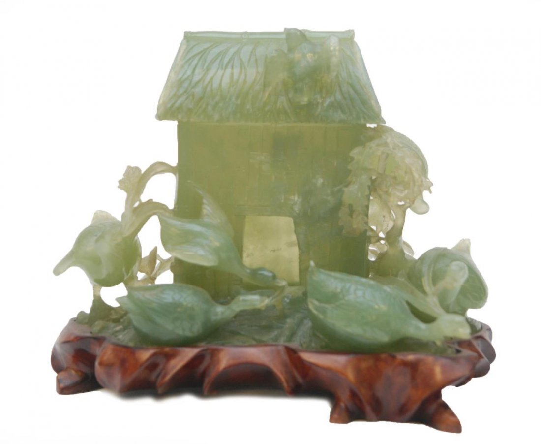 CHINESE CARVED SERPENTINE JADE STRUCTURAL CENSER.: Chinese carved serpentine jade figural censer depicting a bamboo hut with ducks and flowers. Includes fitted wooden base. Measures 6 3/4" height + 1 1/8" base height x 9" length x 6" depth (17.1cm + 2