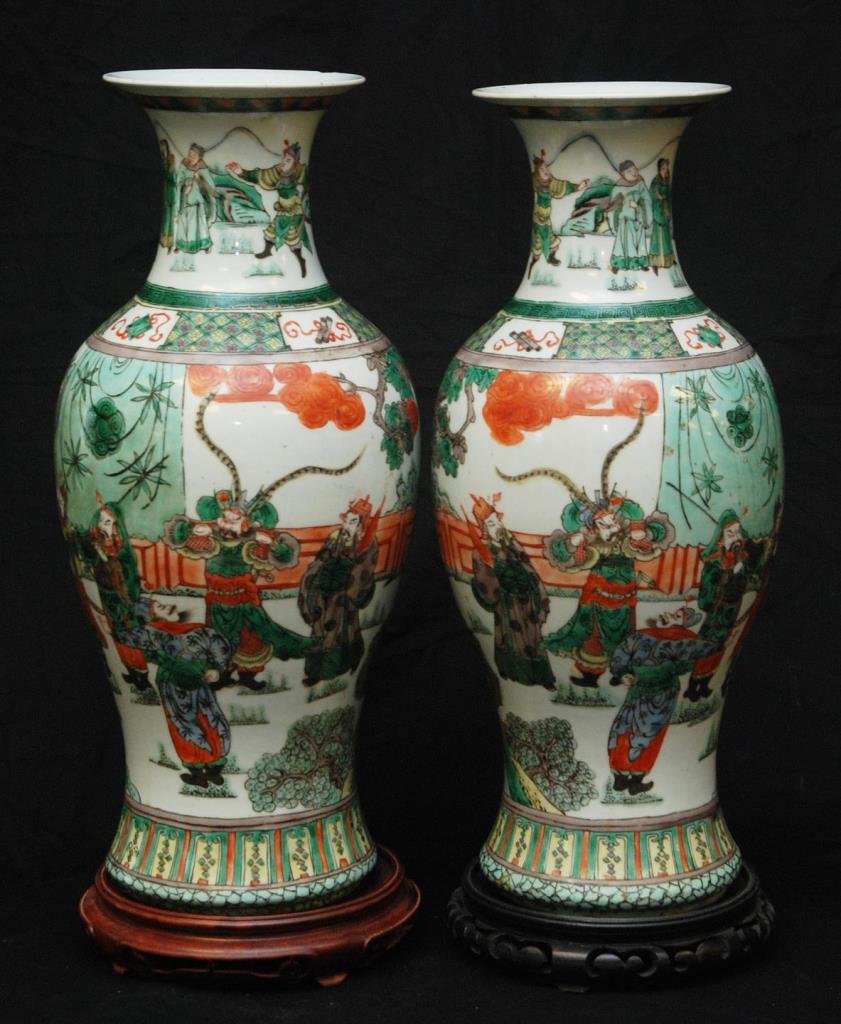 PAIR OF LARGE CHINESE KANGXI WUCAI STYLE VASES: Pair of vintage Chinese wucai vases, decorated with warriors, each vase stands 17 1/2" (44.45cm) tall and comes with its own fitted base. No apparent signature total weight 4300 gms