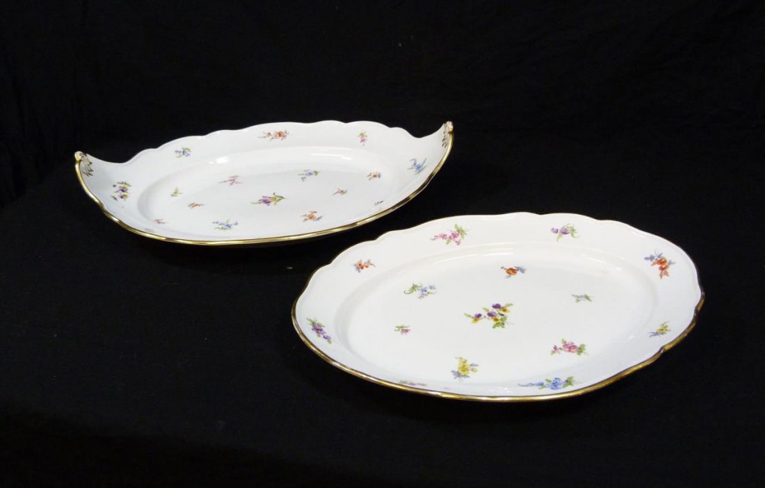 2 MEISSEN GERMAN PORCELAIN OVAL PLATTERS: Two of Meissen German hand painted porcelain 'Scattered Flowers' oval serving platters. Each having the embossed Basket Weave design to rim. Each holds blue underglaze crossed swords mark, 19th/20th c