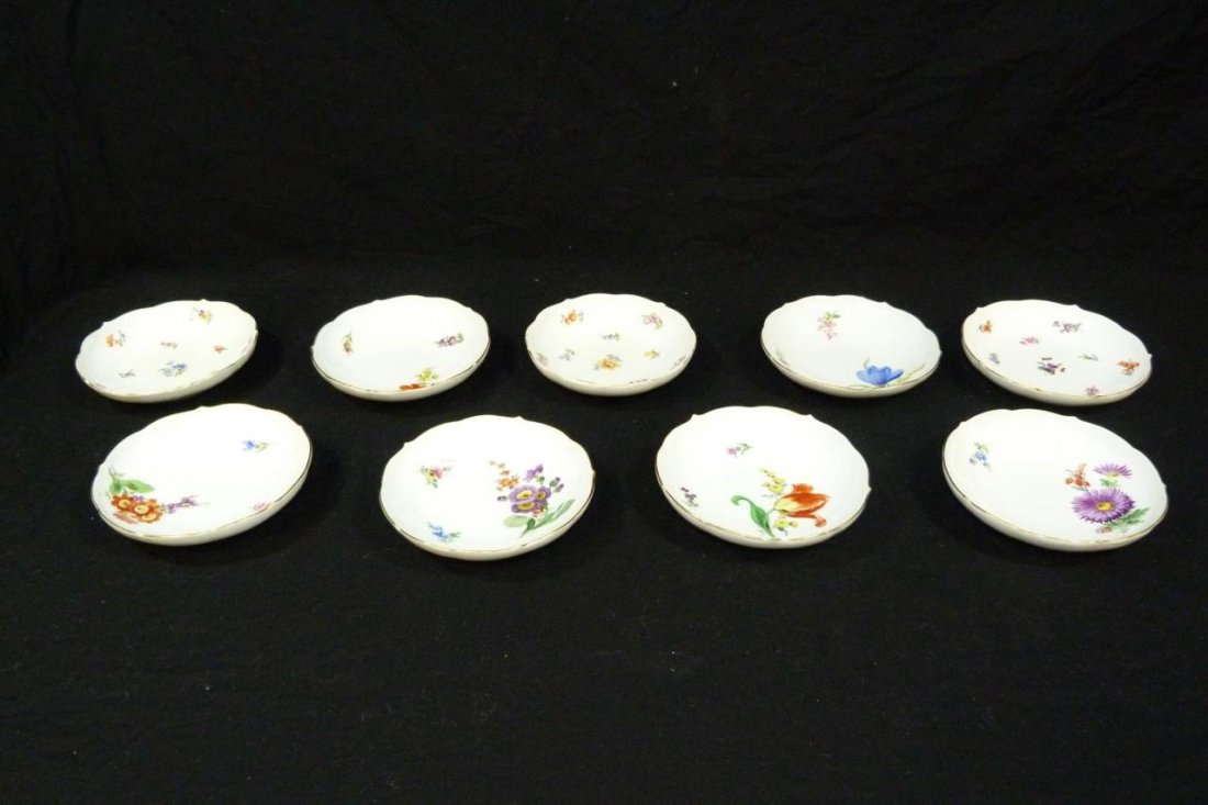 9 MEISSEN GERMAN PORCELAIN FINGER BOWLS: A lot of nine antique Meissen German porcelain bowls depicting 'Scattered Flowers'. Each having scalloped rim with gold trim. Bottoms hold blue under glaze crossed swords marks. 19th century. Measures