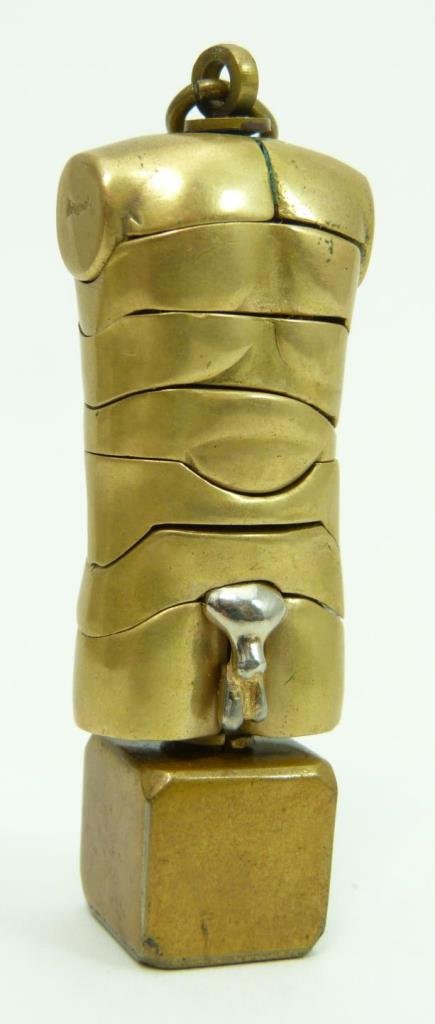 MIGUEL BERROCAL 18KT YG PUZZLE EROTIC KEY RING: MIGUEL BERROCAL 18KT GOLD PUZZLE SCULPTURE EROTIC KEY RING Signed 18kt Gold torso in yellow and white gold depicting a phallic ring. Artist was born in 1933 in Fosca Spain and in known for his puzzle