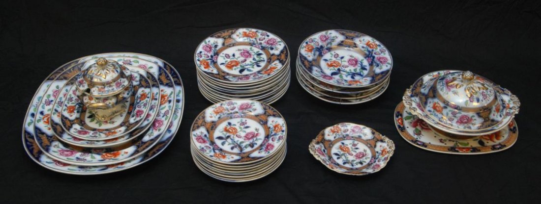 31pc CONTINENTAL ORIENTALIST FLORAL DINNERWARE: Antique set of 31 Continental porcelain dinnerware pieces in the 'Eugenie' pattern. Each having a multicolor Orientalist floral design over white and cobalt ground. Each with impressed marks to bottom
