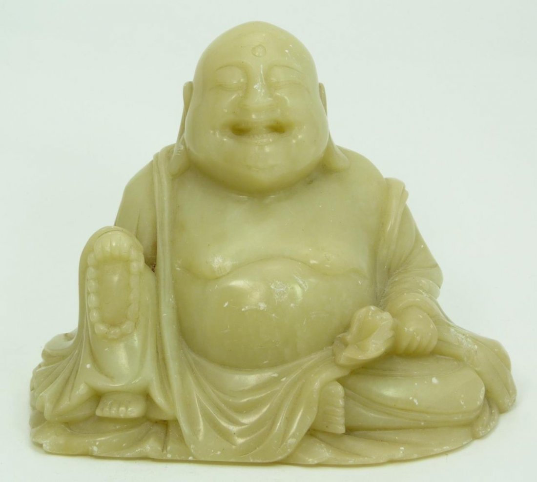 CHINESE CARVED SOAPSTONE SEATED BUDDHA FIGURE: CHINESE CARVED SOAPSTONE SEATED BUDDHA FIGURE Chinese 19th century carved figure of a seated Buddha. Measures 5-1/2" x 7-1/2" wide (13.97cm x 19.05cm) weighs 3102.3g