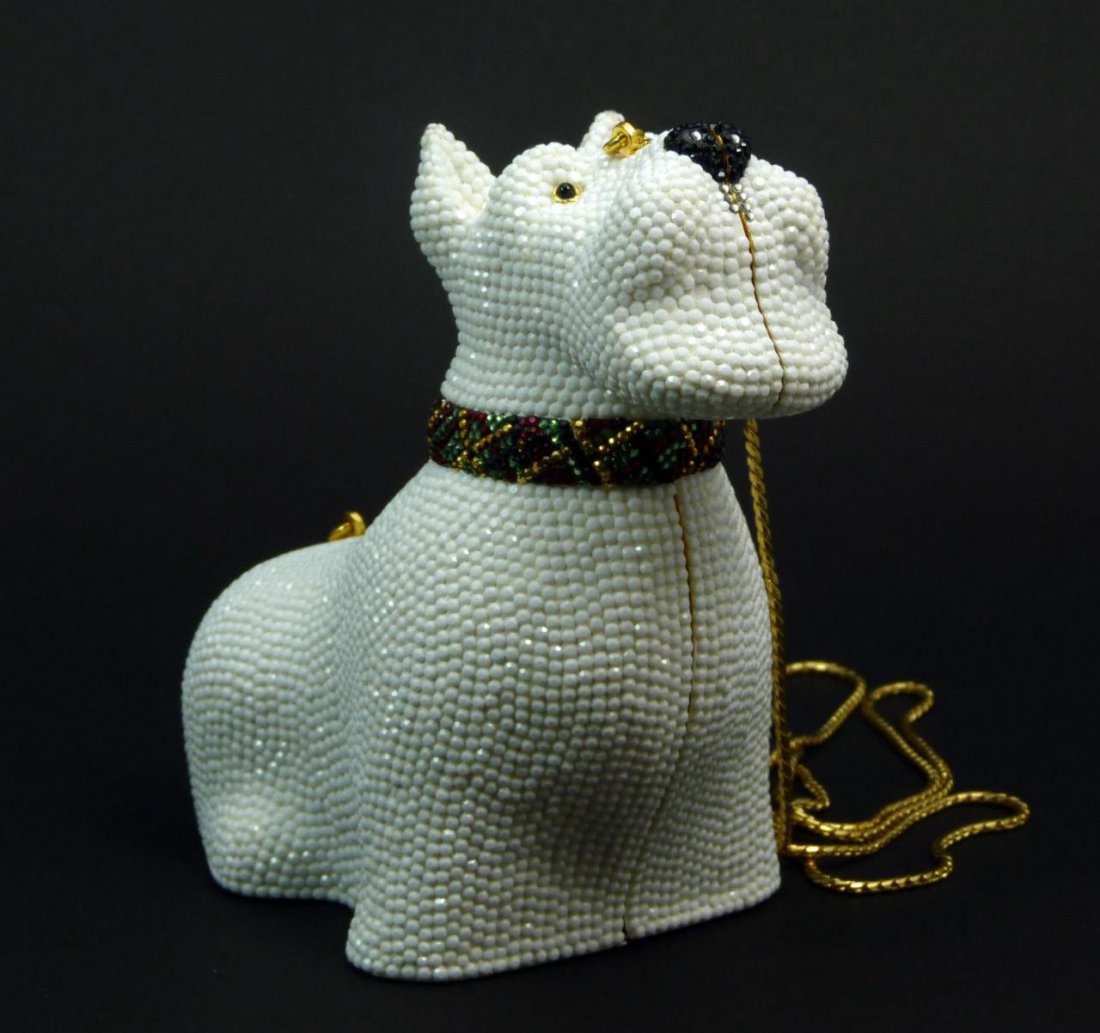 JUDITH LEIBER JEWELED WHITE SCOTTIE DOG MINAUDIERE: JUDITH LEIBER JEWELED WHITE SCOTTIE DOG MINAUDIERE Swarovski crystal Scottie dog in multi colors. Measures 7" wide (17.78cm) in like new condition. Comes with original mirror and change purse, carry i