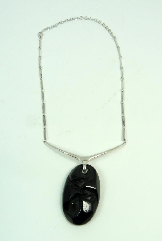 LALIQUE FRANCE "RONCES" NECKLACE: LALIQUE FRANCE "RONCES" NECKLACE Sterling necklace with lovely heavy noir ronces floral crystal pendant. Measures 16" long (40.64cm) with 2" signed Lalique pendant. Total weight 25.12g