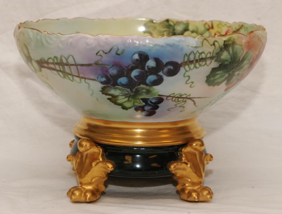 ANTIQUE LIMOGES PUNCH BOWL HAND PAINTED WITH STAND: ANTIQUE LIMOGES PUNCH BOWL HAND PAINTED WITH STAND Turn of the century, hand painted T&V Limoges porcelain punch bowl. Hand painted with grape motif inside and outside. Scalloped rim with gold base. B