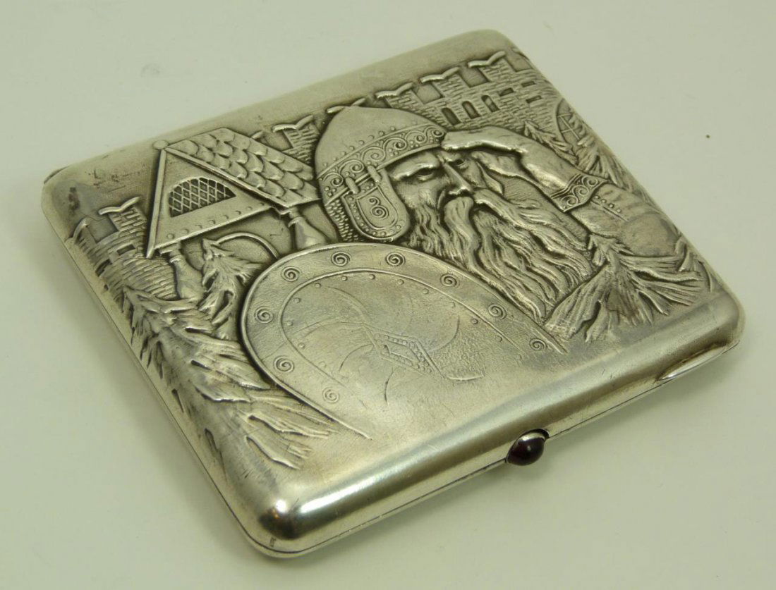 VINTAGE RUSSIAN REPOUSSE SILVER CIGARETTE CASE: VINTAGE RUSSIAN REPOUSSE SILVER CIGARETTE CASE Depicting Peter the great & castle in background. Stamped 875. Onyx stone as clasp. measures 4-1/8" long (10.47cm) x 3-1/2" wide (8.89cm). Total weight 1