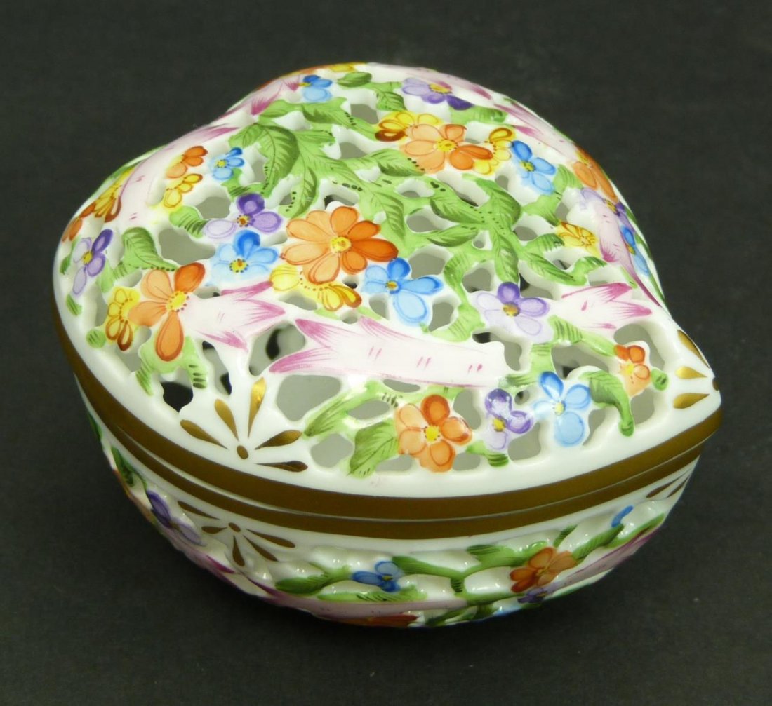 VINTAGE HEREND HEART SHAPED FLORAL BOX: VINTAGE HEREND HEART SHAPE BOX Beautiful highly decorated with hand painted multi color flowers reticulated signed Herend porcelain heart shaped box. The top and bottom section of the box have gold tr
