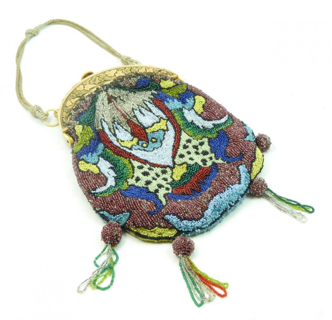 VINTAGE FRENCH BEADED HANGBAG WITH CELLULOID: VINTAGE FRENCH BEADED HANGBAG WITH CELLULOID Vintage Beaded Purse Carved Floral Celluloid Frame with Fringes, with attached mirror. Measures 9-3/4" long x 7" wide (24.76cm x 17.78cm). Total weight 290