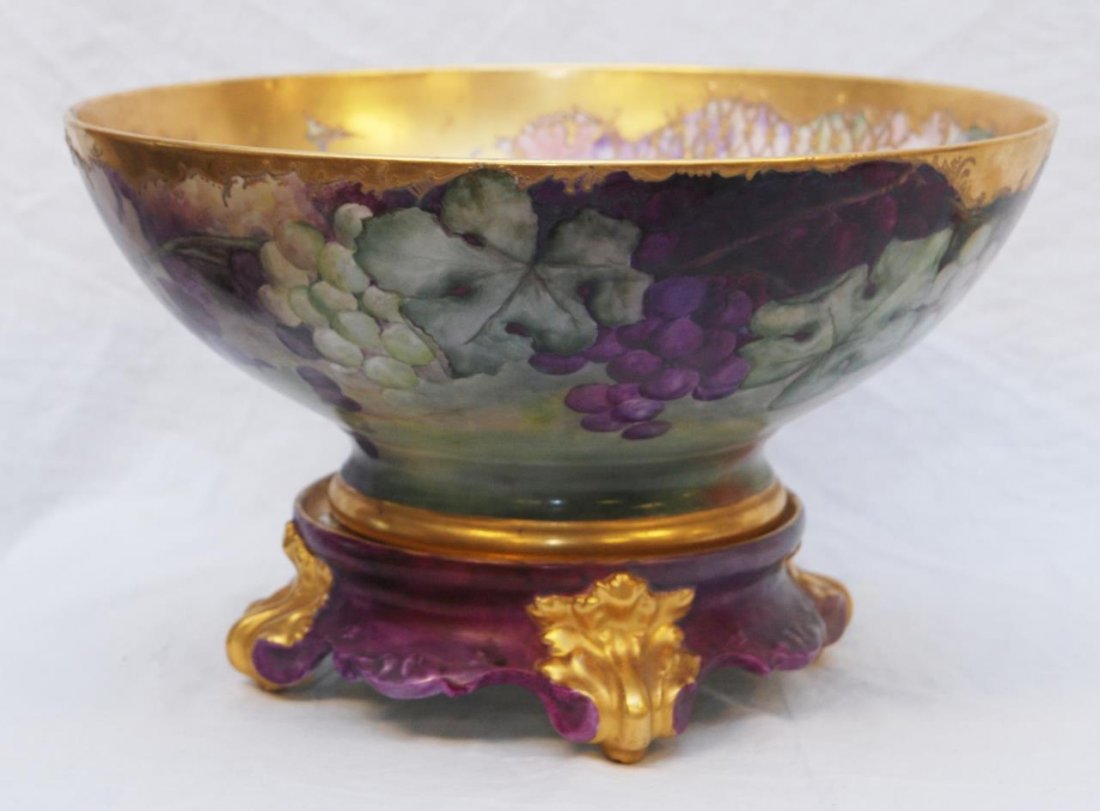 ANTIQUE LIMOGES HAND PAINTED PUNCH BOWL WITH STAND: ANTIQUE LIMOGES HAND PAINTED PUNCH BOWL WITH STAND Turn of the century by the Tressman & Vought TNV Limoges Co. this large 15" bowl (38.1cm) is beautifully painted with grape design. Comes with origin