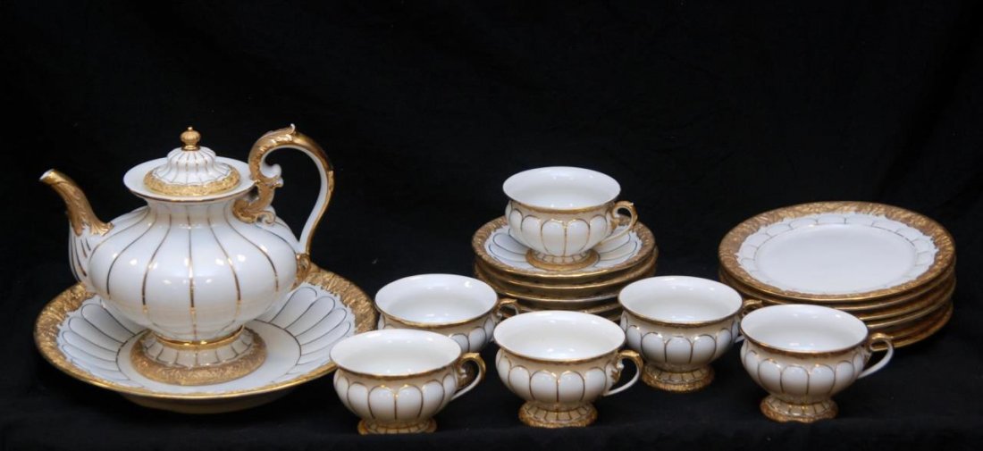 ANTIQUE MEISSEN GOLD RIM DESSERT SET: ANTIQUE MEISSEN GOLD RIM DESSERT SET. 20pcs of vintage Meissen to include a large tea pot 8" tall (20.32cm), along with a center bowl 10-1/2" (26.60cm), 6 cups, saucers and cake plates. All pieces hav